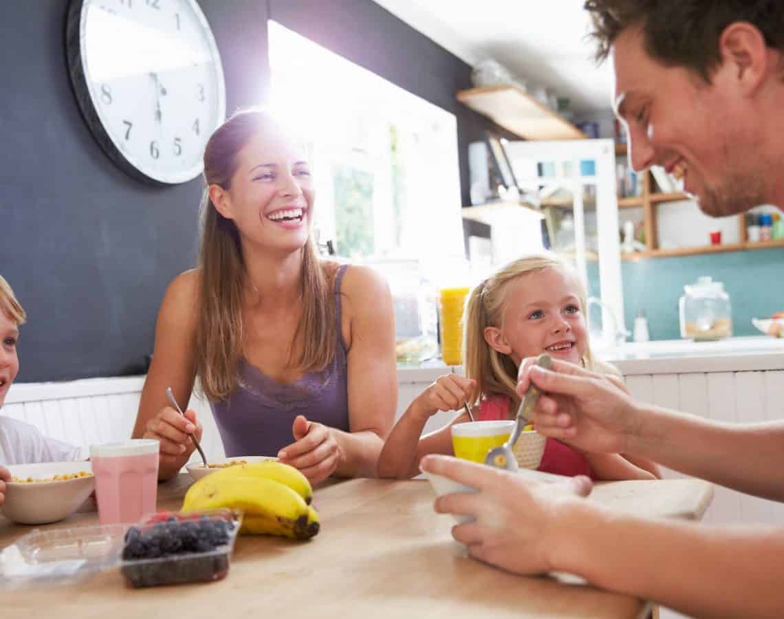 Family eating breakfast together