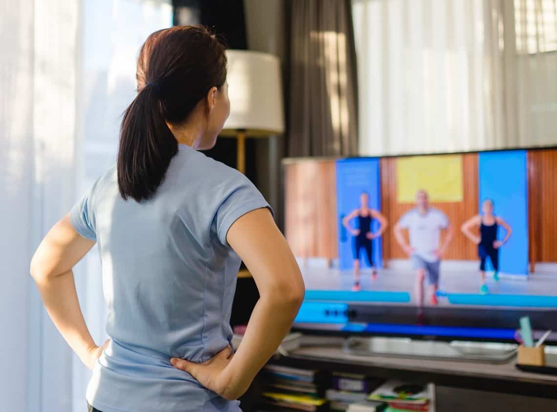 Woman following a home workout video