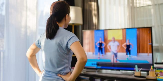 Woman following a home workout video