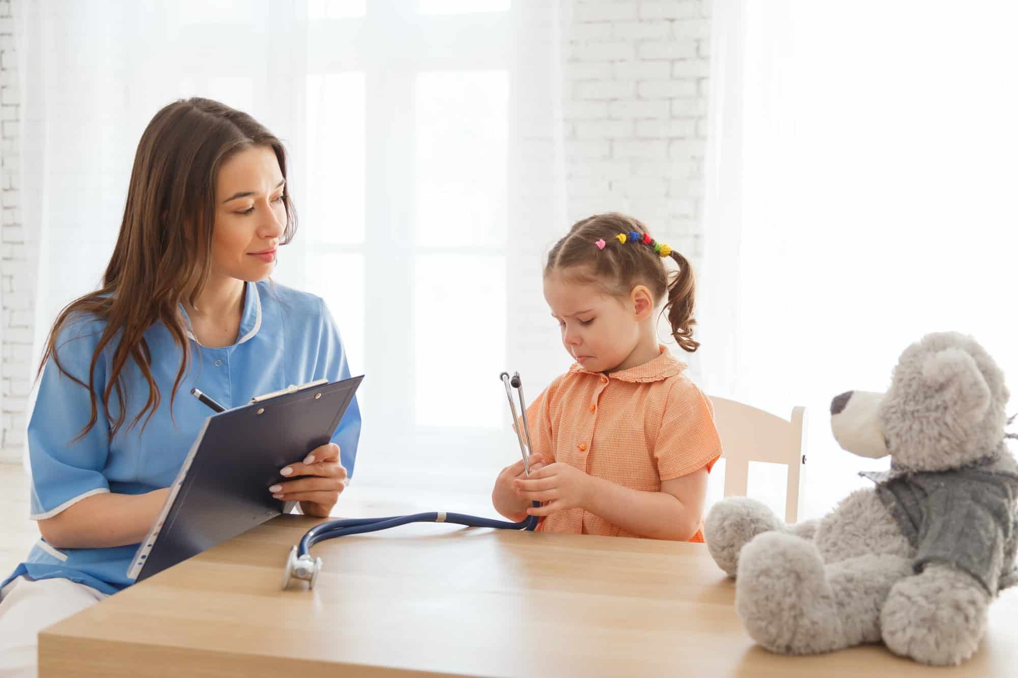 Child girl at the reception of a pediatrician.