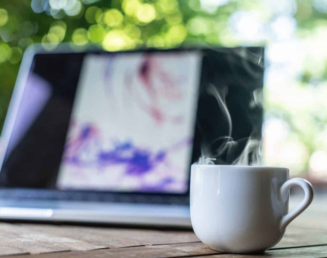 Laptop and mug on a table