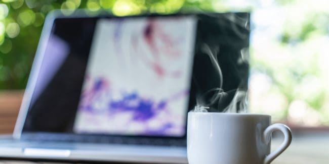 Laptop and mug on a table
