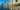 Jogger jogs on a path along the river with Brisbane city in the foreground
