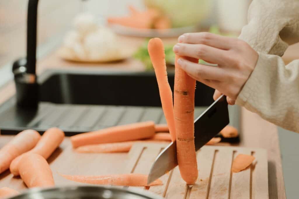 Cutting the peel from a carrot