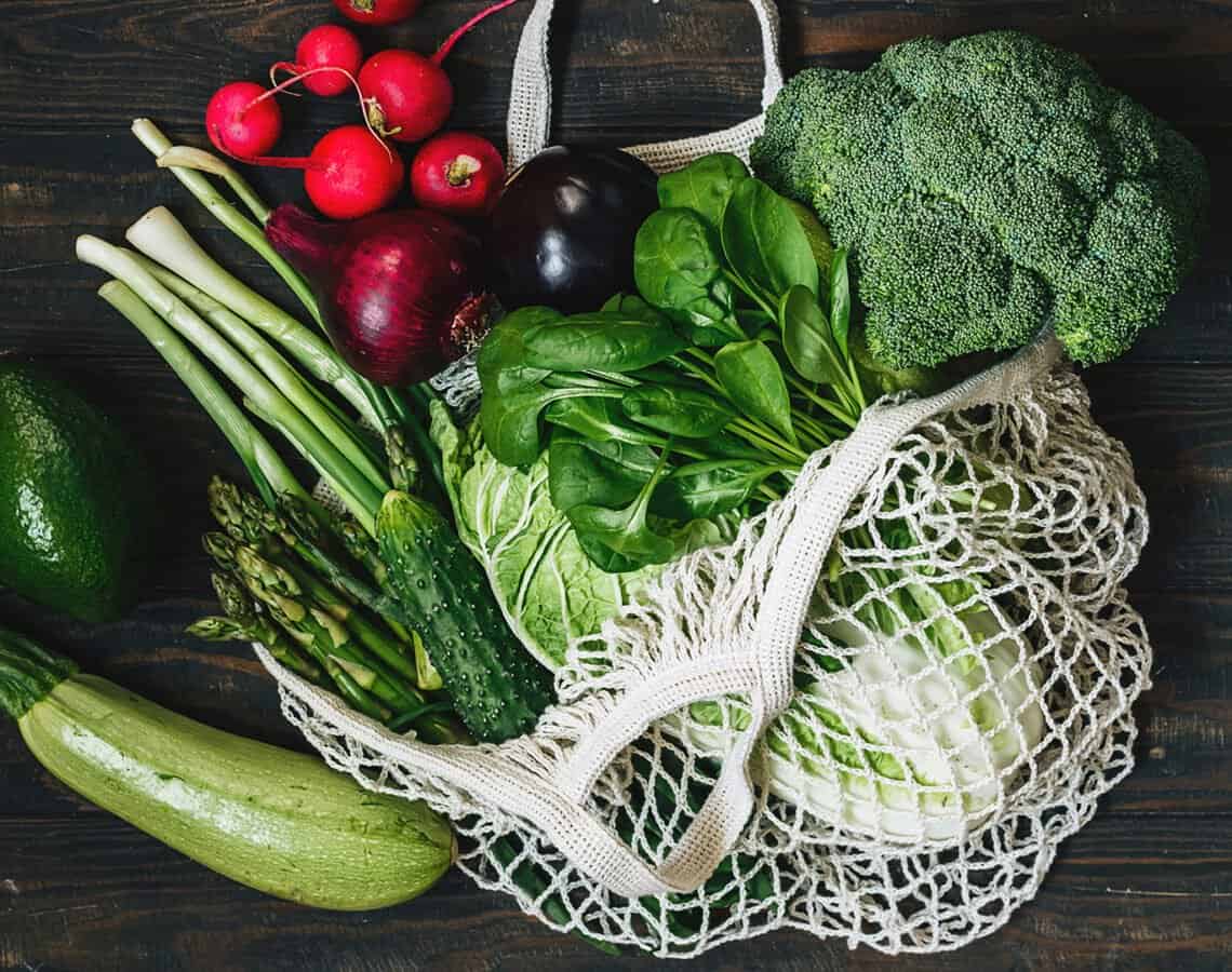 String bag of mixed, whole vegetables