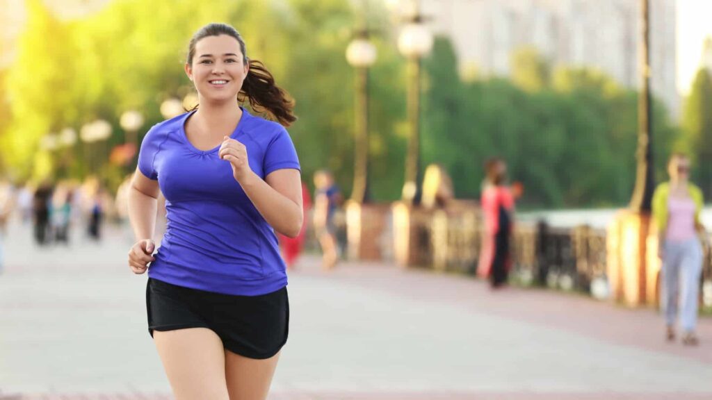 Woman running across bridge