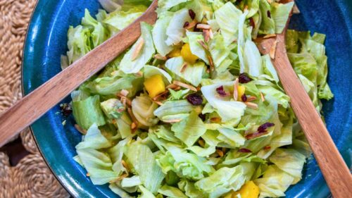 Close up of mango and avocado salad in a blue bowl