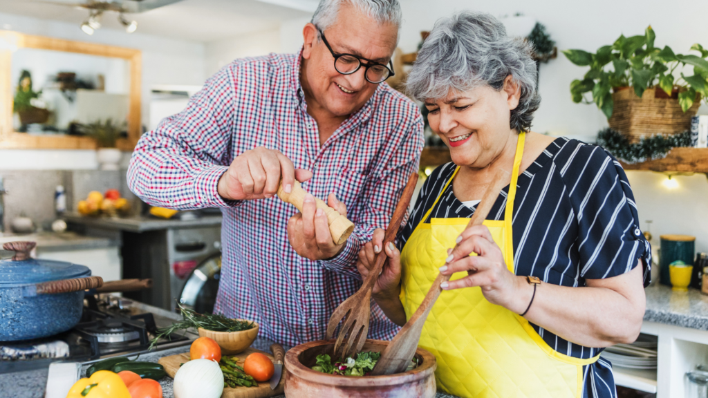 Senior couple cooking dinner together