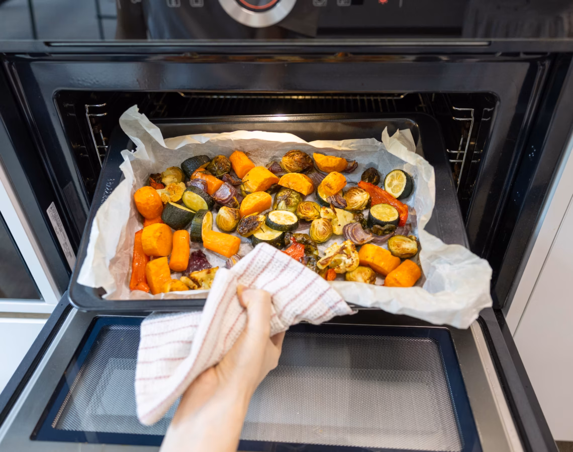 Roasted vegetables coming out of the oven