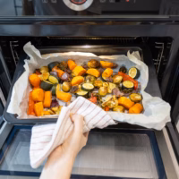Roasted vegetables coming out of the oven