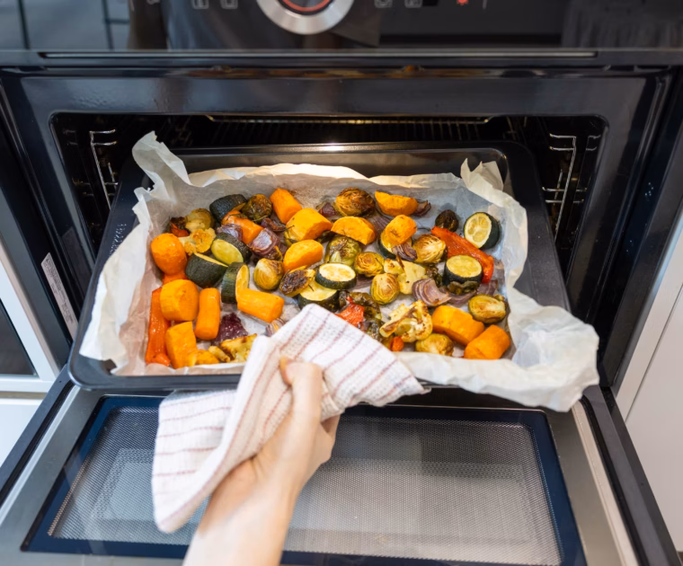 Roasted vegetables coming out of the oven
