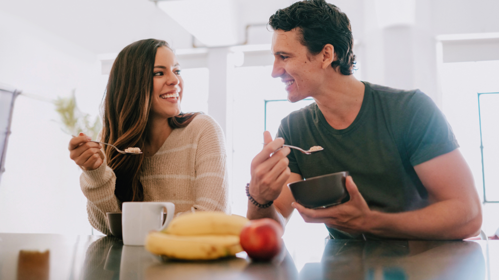 A couple eating breakfast together