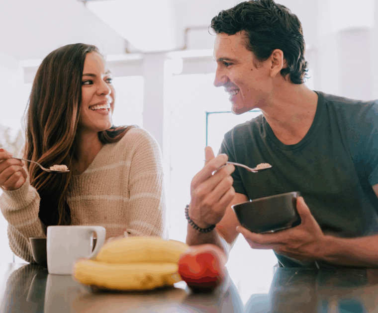 A couple eating breakfast together