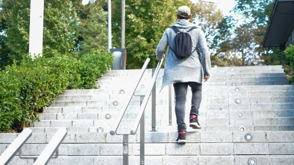 Person walking up steps