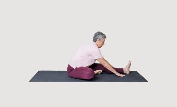 Seated forward fold with one leg extended out in front