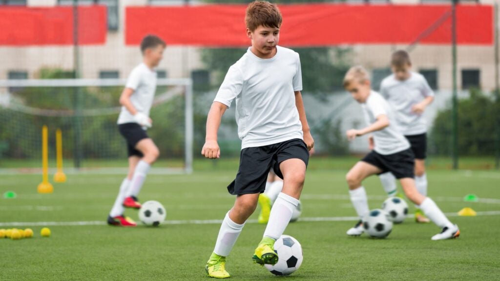 Boys doing soccer drills