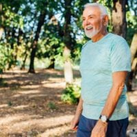 Mature man walking in the woods
