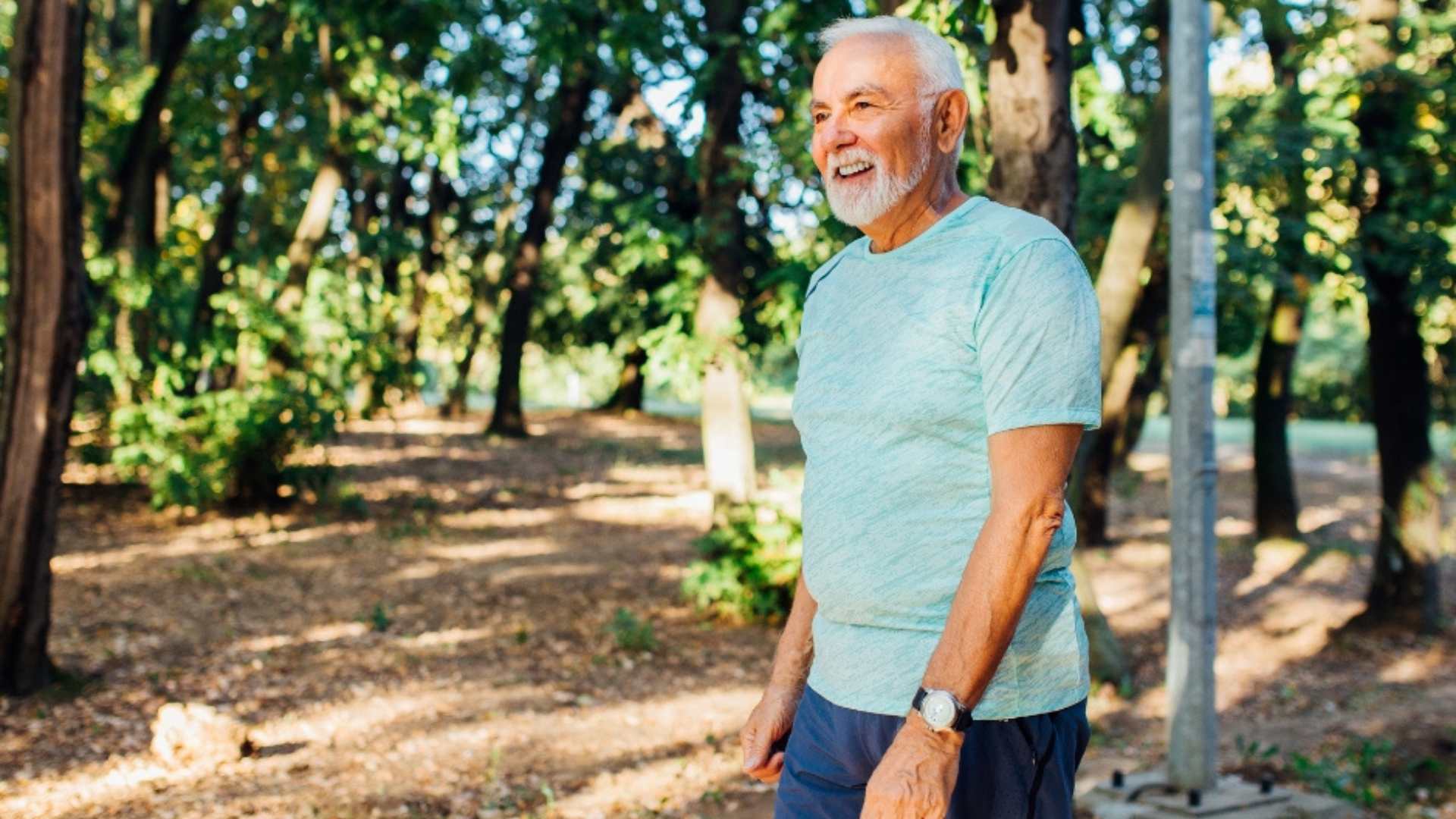 Mature man walking in the woods