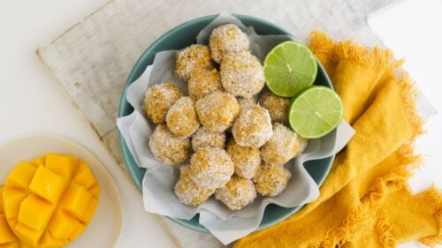 Mango coconut bliss balls in a bowl
