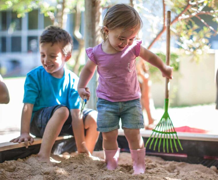 Young children in sandpit