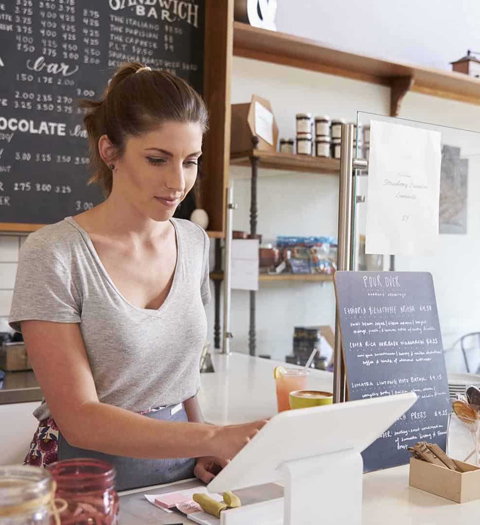 Lady serving healthy food at a cafe counter