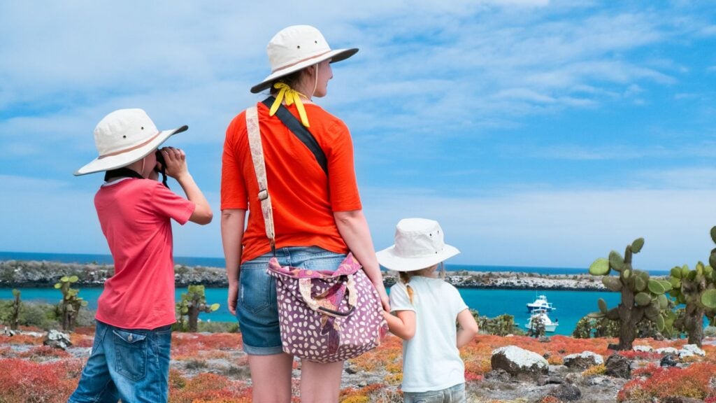 Mother and two children look out over ocean view