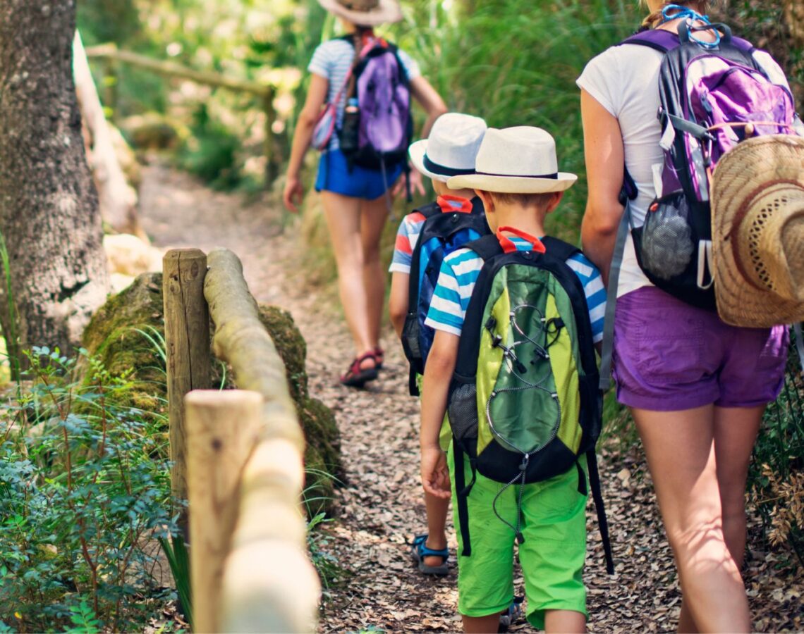 Woman and kids go on a hike together