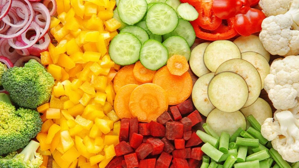 Variety of colourful sliced vegetables