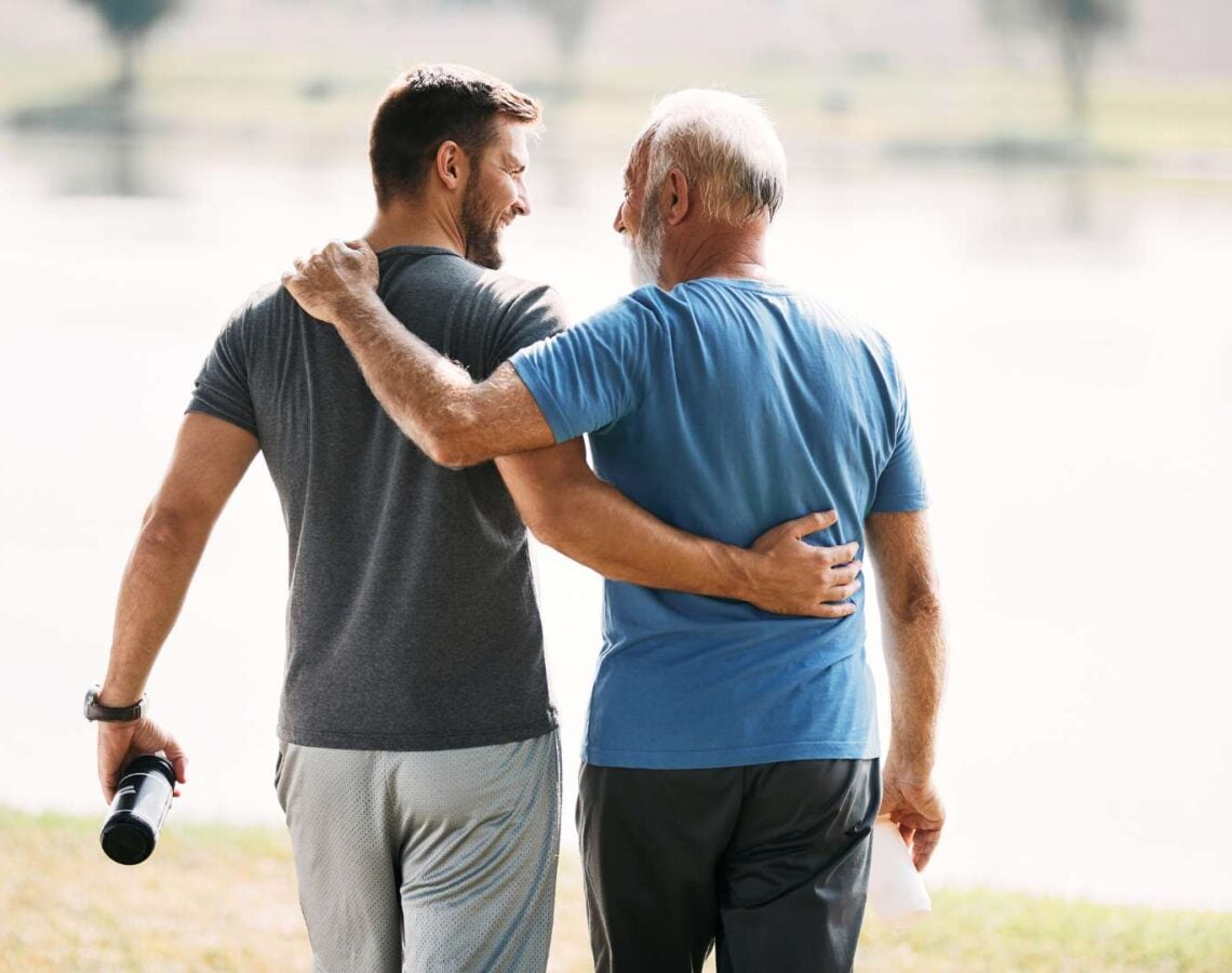 Two men support one another