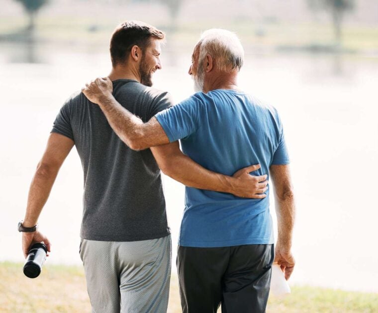 Two men support one another