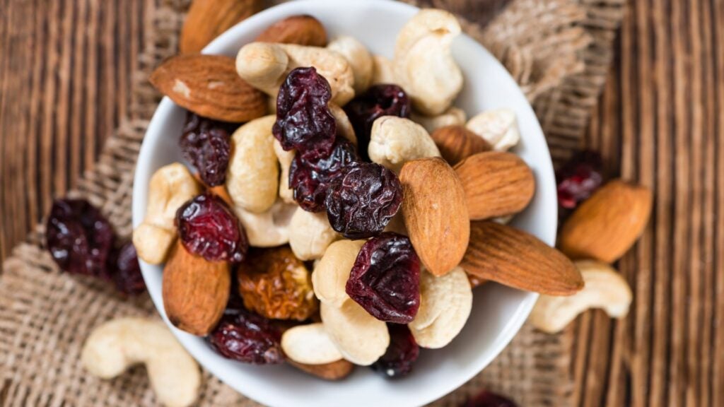 Healthy snack of trail mix with dried fruit and unsalted nuts