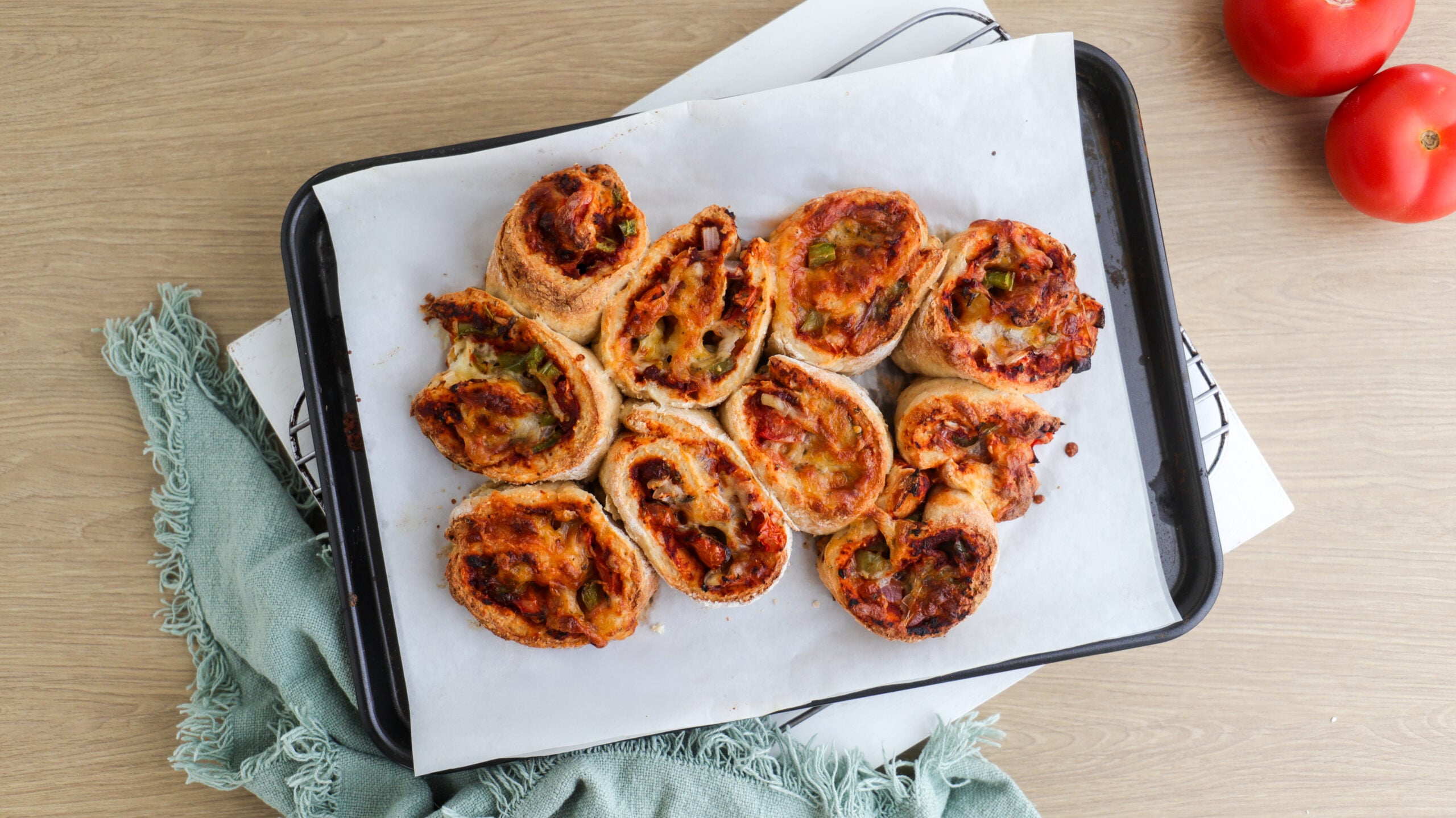 Pizza scrolls on a baking tray
