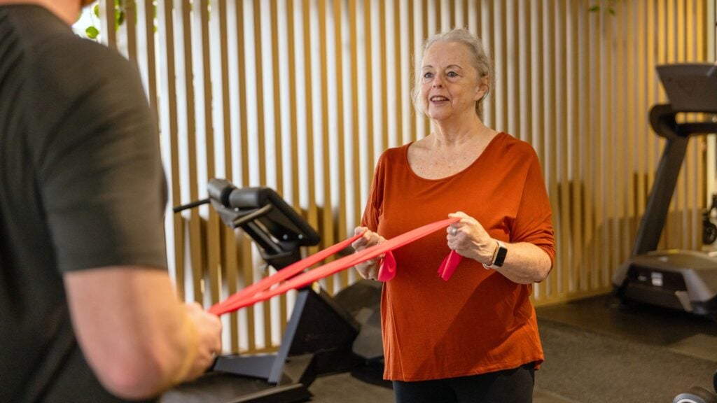 Woman uses a resistance band