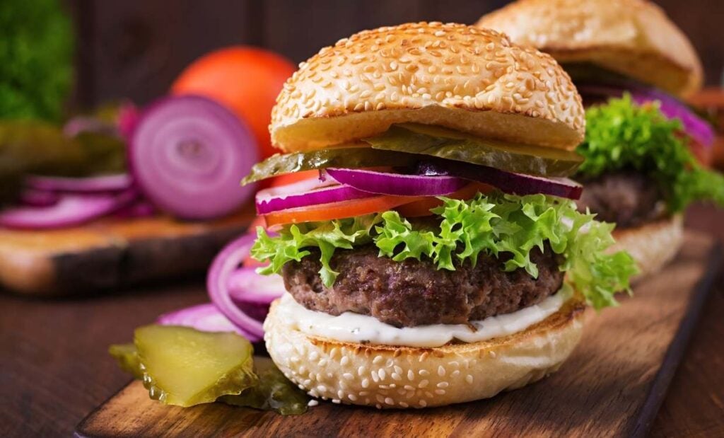 Homemade beef burger with lettuce, tomato, onion