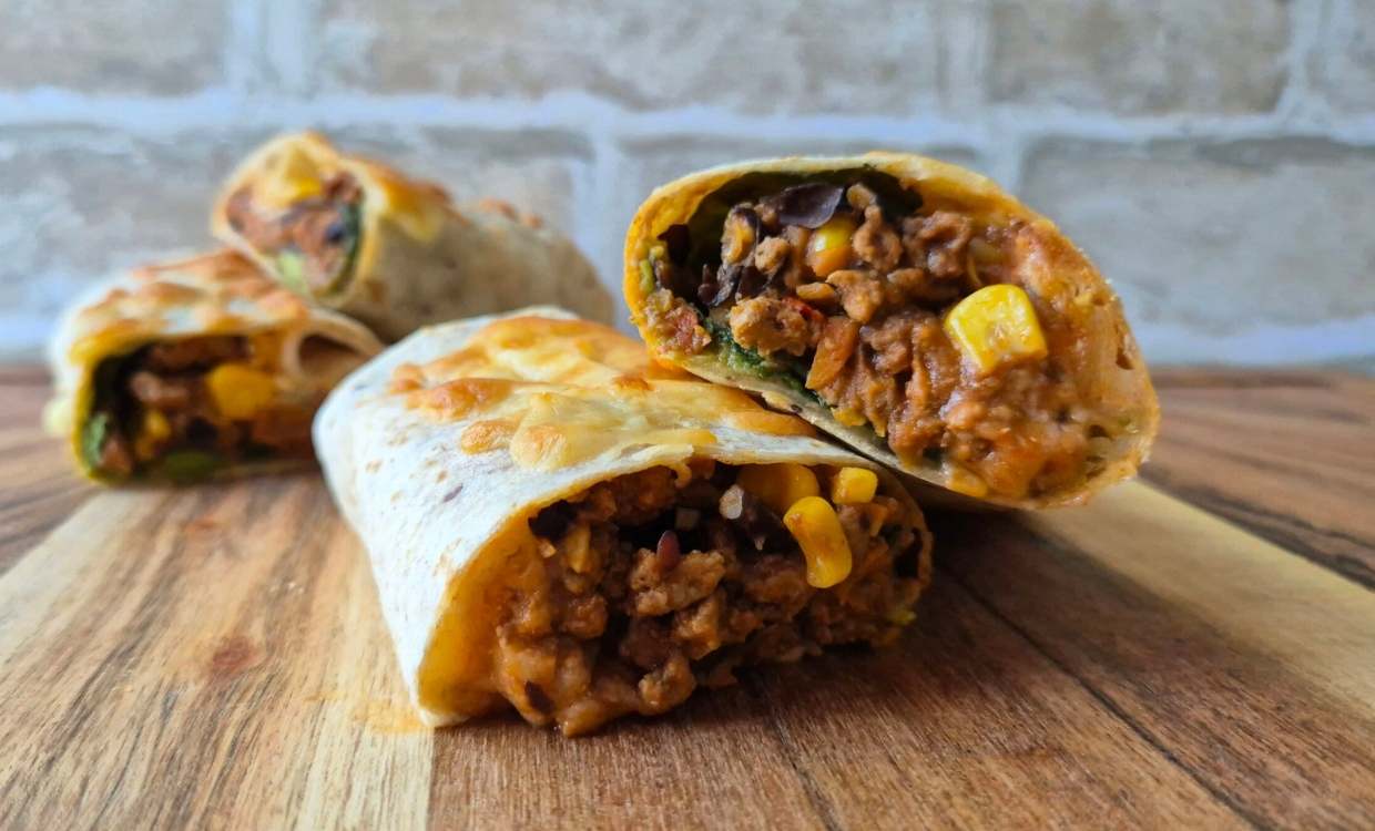 Taco roll filled with beef mince, corn, spinach, cheese and salsa