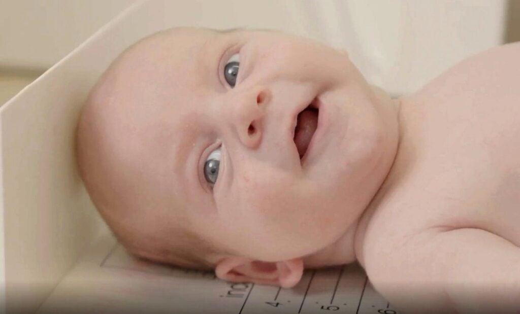 Young baby being measured