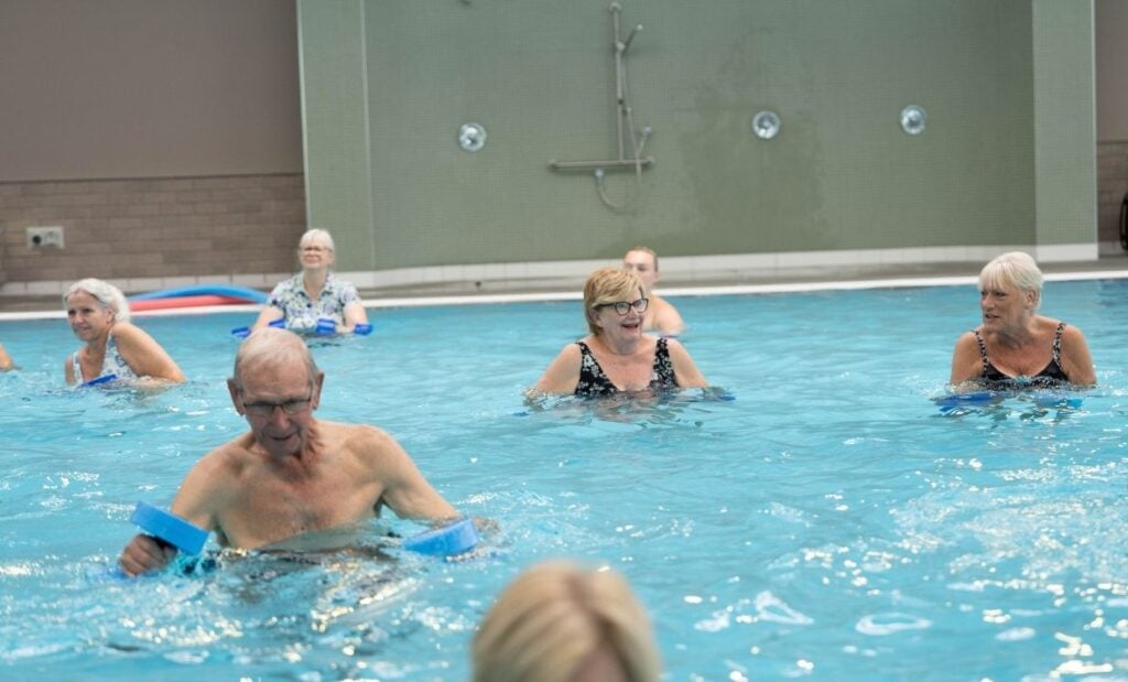 Seniors do an aqua aerobics class
