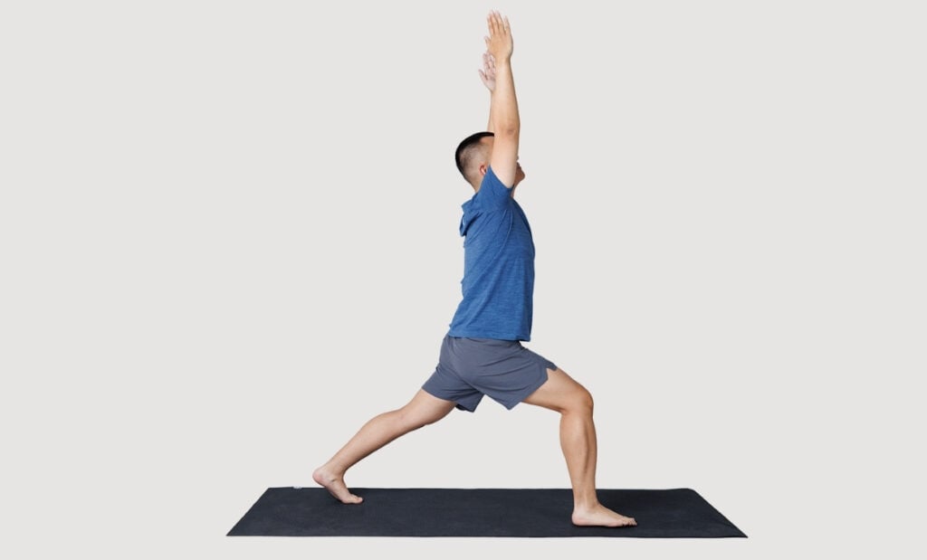 Standing hip lunge with arms extended overhead