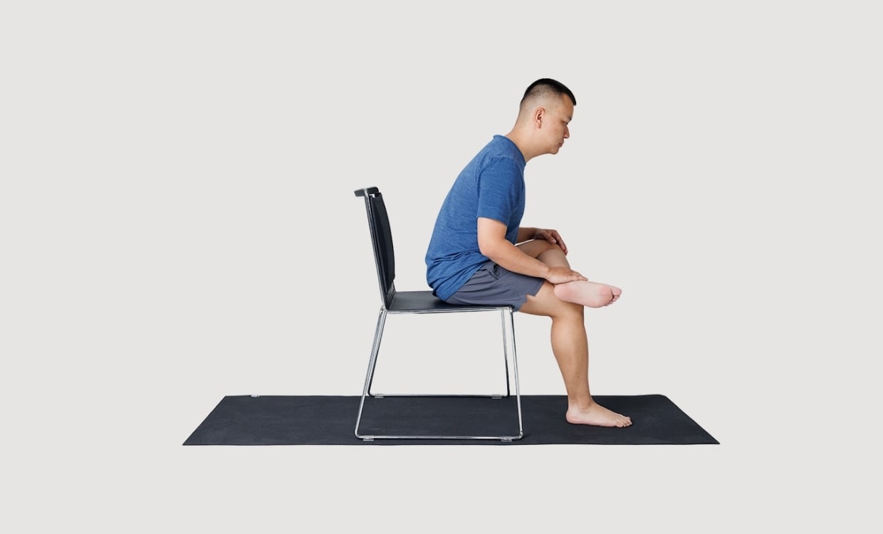 Seated forward fold in a chair