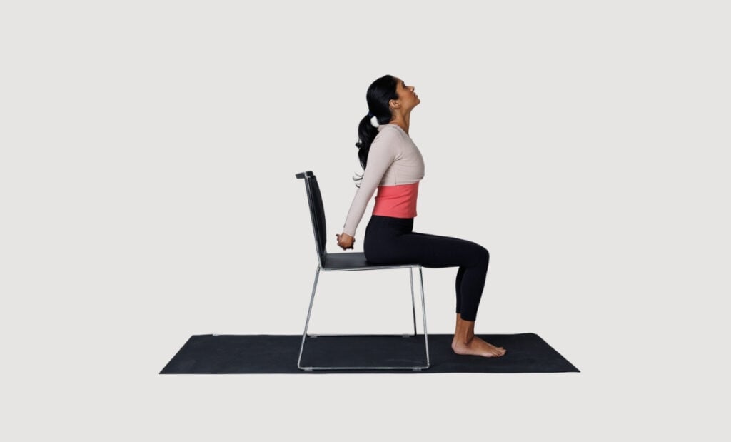 Seated shoulder opener in a chair