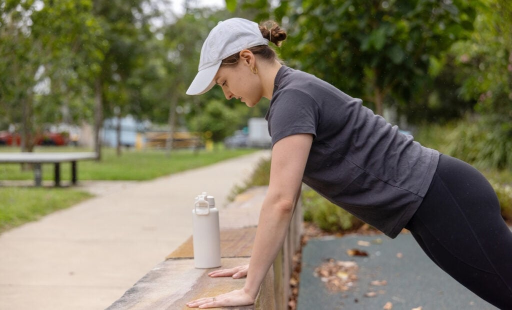Woman does a modified push up as part of a low impact workout